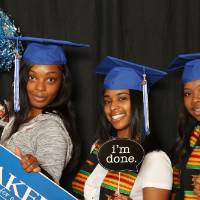 photobooth three friends with props
